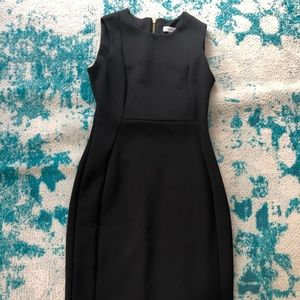 Calvin Klein | size 6 black fitted dress with gold zipper in back